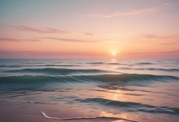 Wall Mural - A serene ocean landscape with calm, rippling waves reflecting the warm, pastel-colored sky and bright sun in the distance