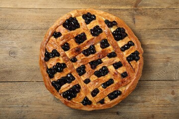 Wall Mural - Tasty homemade pie with blueberries on wooden table, top view