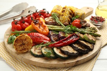 Wall Mural - Delicious grilled vegetables with spices on white table, closeup