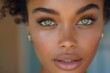 © Dassen - Young black woman with freckles is posing with eyes wide open