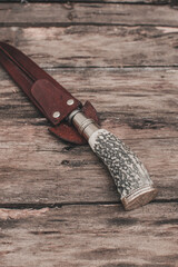 Handmade knives on wood, catalog photo.