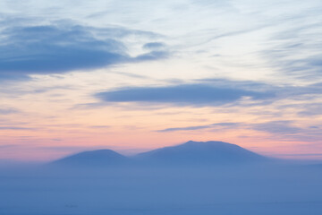 Wall Mural - picturesque arctic landscape. view of the snow-capped mountains at sunset. cold winter weather. fros