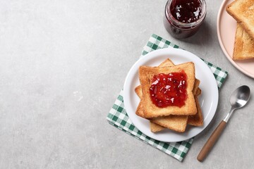 Wall Mural - delicious toasts with jam on light table, flat lay. space for text