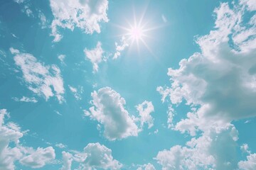 Wall Mural - A bright sun shines through white clouds in a clear blue sky, perfect for a sunny day or a mood booster