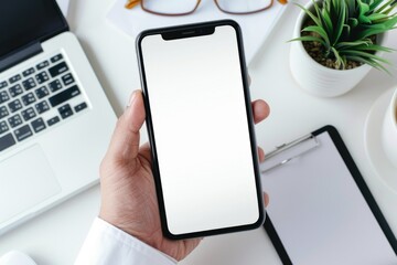 Canvas Print - A person is holding a cell phone in their hand, ready to make a call or check messages