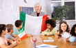 © JackF - in geography lesson, students carefully listen to woman teacher who talks about Italy
