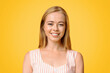 © Prostock-studio - Young And Beautiful. Portrait Of Smiling Teen Girl With Natural Blonde Hair Over Yellow Background, Closeup
