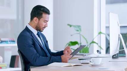 Wall Mural - Annoyed male looking frustrated, upset with slow internet and bad connection while browsing. Angry businessman trying to cancel a subscription on a digital tablet while sitting in a modern office.