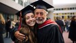 © Zamin - Happy graduate student in cap and gown hugs her proud father after ceremony