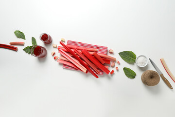 Ripe stalks of rhubarb on a light background