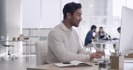 Sticker - Young business man working on a computer in an office. Confident and happy entrepreneur smiling while typing emails and compiling online reports. Doing research and planning in a startup company