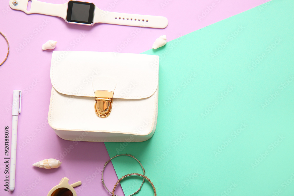 Stylish bag and different accessories on colorful background