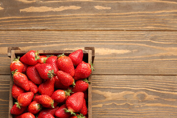 Sticker - Box with fresh strawberries on wooden background