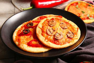 Wall Mural - Plate with different tasty mini pizzas, closeup