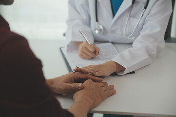 Female doctors shake hands with patients encouraging each other To offer love, concern, and encouragement while checking the patient's health. Concept Health care and Social Security