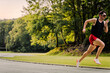 © Uri Prat - Young male sprint runner in the track race with copy space