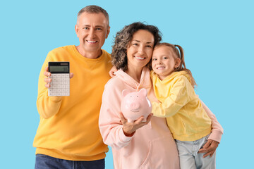 Poster - Happy family with piggy bank and calculator on blue background