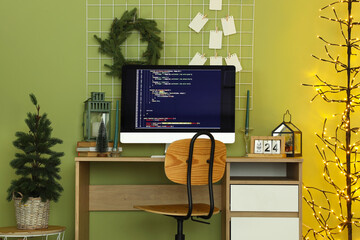 Canvas Print - Interior of programmer's office with workplace, Christmas tree and glowing lamp