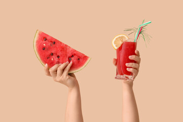 Poster - Female hands with slice of sweet watermelon and glass of fresh juice on beige background