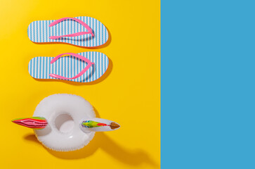 Poster - A vibrant summer vacation scene with flip flops and a floating flamingo