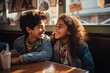 © Valeriia - First relationship of school pupils couple laughing having a date in cafe restaurant. Smiling kids, first love relationship concept