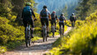 © supee - Group of people cycling on a trail in nature