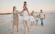© peopleimages.com - Parents, grandparents and walk with kids at beach, sunset and girl on shoulders for holiday. Men, women and children on care, vacation and piggy back with holding hands for love by ocean in Spain