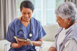 © Lumeez23/peopleimages.com - Happy woman, nurse and patient with tablet in elderly care for home assistance, checkup or advice. Young female person or medical caregiver talking to mature client on technology for healthcare plan