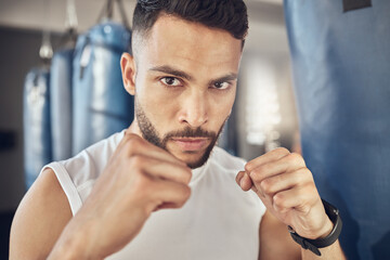 Canvas Print - Man, portrait and fist for workout in gym for fighting tournament, match or training for competition. Male person, serious and ready for challenge or sport, self defense and mma performance or boxing