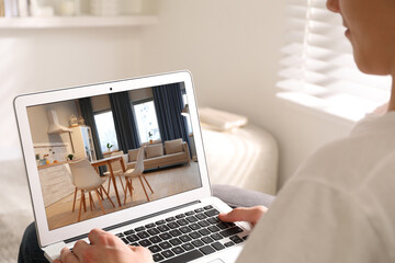man looking for house on real estate market website at home, closeup