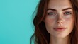 © MR.DEEN - Close up portrait of beautiful girl with brown hair and freckles on face, copy space, isolated turquoise background