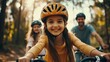 © Oulaphone - Happy family cycling in the forest, Father, mother and daughter wearing helmets with bicycles, Family outdoor activity concept.
