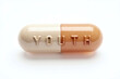 © Sweeann - Capsule pill labeled 'YOUTH', a drug you can swallow to stay young and vigor, turn back time, increase lifespan, live forever. Concept on anti aging, cure for growing old, medicine for eternal life.