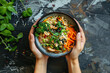 © Valeriia - Top view of female hands with bowl of spicy chinese thai instant noodles with chicken and vegetables. Tasty asian food meal concept