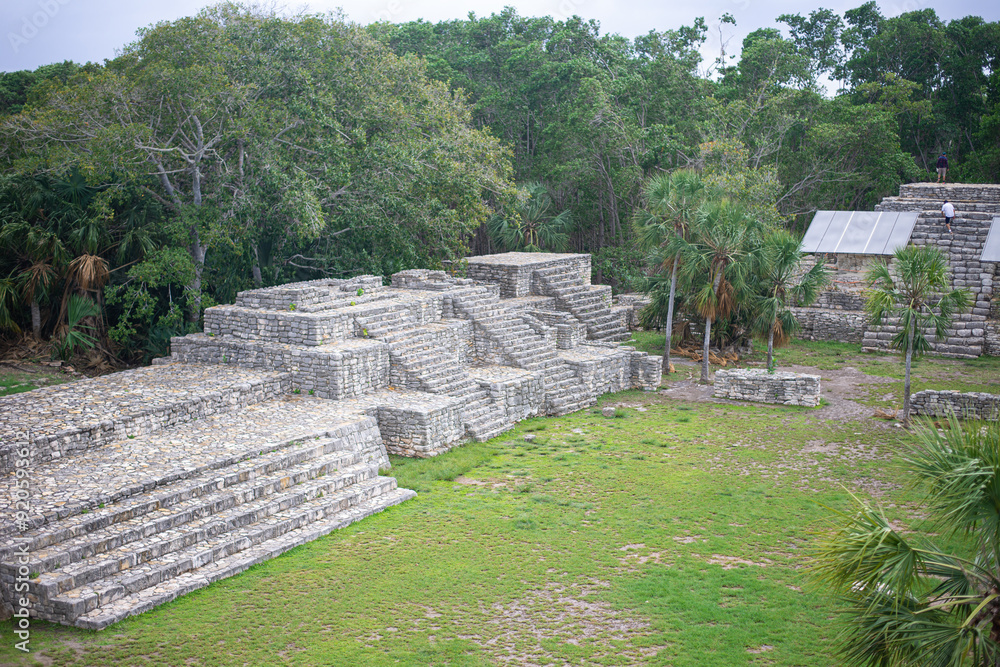 complex of mayan pyramids with wide impressive steep stairs in ancient ...