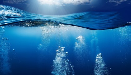 Underwater view with bubbles rising to the surface in a deep blue ocean. The image captures the serenity and mystery of the underwater world