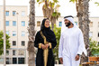 © oneinchpunch - Traditional arab couple wearing emirati clothing dating outdoors - Middle-eastern married woman with abaya and man with kandura meeting and having fun in the city