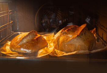 The sourdough bread in the oven forms a beautiful crispy crust.  