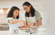 © DavisShared/peopleimages.com - Baking, cupcake and mom with child in kitchen with icing for cake, treats and dessert for bonding relationship. Family, home and mother and girl with ingredients, recipe and learning for fun together