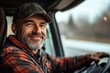 © Harvinder - Happy truck driver looking through side window while driving his truck, Generative AI