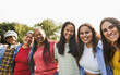 © DisobeyArt - Multi generational women smiling in front of camera - Female multiracial group having fun togheter outdoor - Main focus on right girl face