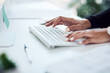 © Frank Coop/peopleimages.com - Hands, keyboard and typing at desk for remote work, research and editing. Person, journalist and wireless technology in home office for article, news update and language translation for information