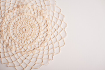 Handmade white crochet doily, ideal for table settings or as a decorative accent piece.