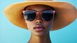 © Ratchadaporn - Fashionable Sunglasses and Sun Hat Accessory Combination for Chic Summer Style