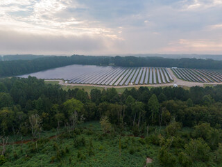 Morning Drone Images of a Large Renewable Solar Farm in Louisburg North Carolina Using Technology and Science for Green Energy & Lowering Carbon Footprints. 