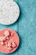 © yuliachupina - Colorful textures of creamy whipped toppings on solid blue background
