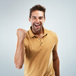 © Chanelle2000/peopleimages.com - Achievement, smile and winner with portrait of man in studio on white background for discount or success. Celebration, fist and motivation with happy person cheering yes for bonus, goal or target