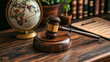 © myjadeite - a legal gavel placed on a modern management work table. globe and justice balance scale beside for anti trust