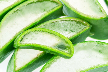 Fresh cuts of aloe vera leaf, macro shot of inner gel.