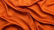 © tonstock - Smooth orange silk fabric with soft folds creating an elegant and luxurious texture, perfect for backgrounds and design projects.